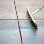 Concrete finishing broom with handle